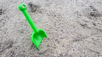 Fototapeta na wymiar shovel in the sand