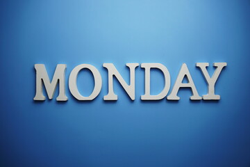 Monday alphabet letter on blue background