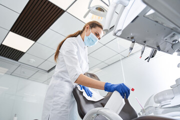 Dentist sterilize the medical equipment inside a dental clinic