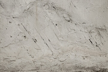 Beautiful texture with light grungy concrete. Grainy background with small cracks and strokes. Building material for decoration and design.