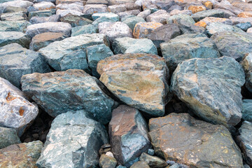 Closeup to the big stones located on the ground. Shot at bright summer day.