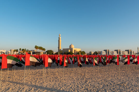 UAE Flag Day celebration with set up of Flag Garden, located at Kite Beach, Dubai in front of the mosque. 4000 flags were used  to make portraits of leaders. Shot at daytime. 