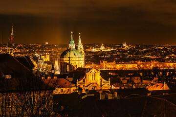 Naklejka premium Night view of Old town with hictorical buildings,churches,towers in Prague,Czech republic.Prague evening panorama.Amazing European cityscape.Night city lights.Travel city concept.Urban scenery
