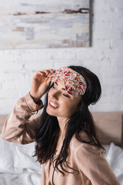  Young Brunette Woman Sitting In Bed In Sleep Mask