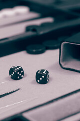 Backgammon set,  ready to start game,  on a cloth and leather board.  With colour toning