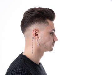 Fototapeta premium young handsome man on profile view looking to copy space ahead, thinking, imagining or daydreaming