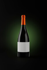 Bottle of red wine in a dark background