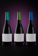Three Bottles of red wine in a dark background