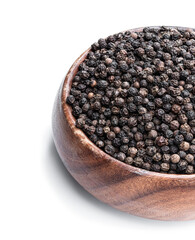 Black pepper corn in wooden bowl isolated on white