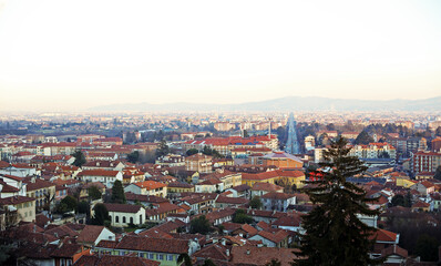 High angle landscape of Turin city, Piedmont region, North Italy with red roofs and road 