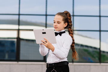 Little school girl having phone talk with friend. modern life communication. Living in digital age.