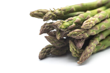 Closeup of organic asparagus on white background
