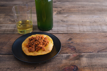 Mincemeat with corn and cider cakes on a wooden base. Copy space.