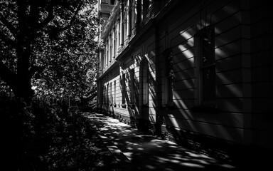 Black and white building exterior with sunlight