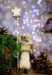 mouse with a staff near the Christmas tree