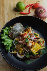 Hot and spicy green mango salad with crab. Thai seafood salad. Yum Pu Ma. Thai food style
