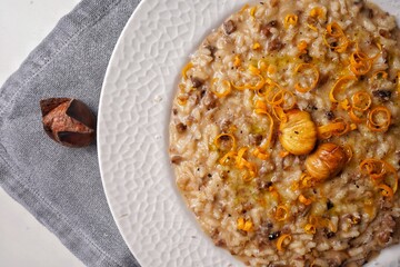 Risotto with chestnuts and citrus. Top view.