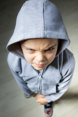 Portrait of happy little cool boy  wearing hooded sweatshirt.