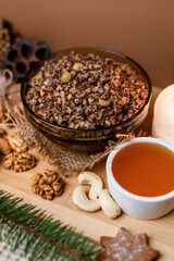 Kutia is a wheat Christmas porridge.  Traditional Christmas dish of the Slavs. Kutia with raisins, nuts, poppy and honey on dark background. Top view. Christmas atmosphere. 
