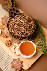 Kutia is a wheat Christmas porridge.  Traditional Christmas dish of the Slavs. Kutia with raisins, nuts, poppy and honey on dark background. Top view. Christmas atmosphere. 