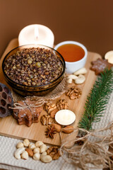 Kutia is a wheat Christmas porridge.  Traditional Christmas dish of the Slavs. Kutia with raisins, nuts, poppy and honey on dark background. Top view. Christmas atmosphere. 