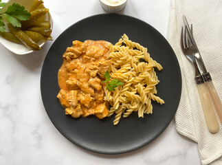 Classic chicken goulash with fusilli pasta in sour creme sauce. 