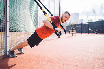 Young sportsman doing resistance training