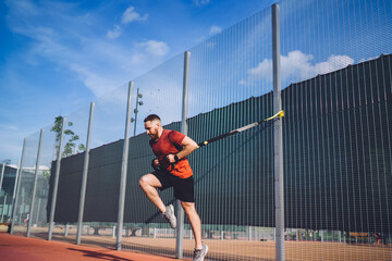 Sportsman exercising on sports ground