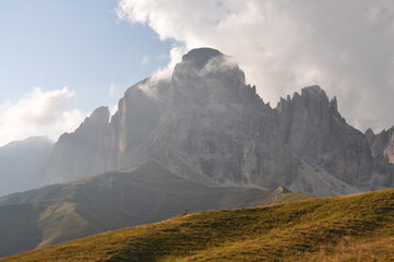 A majestic ridge in the Sassolungo massif seen from a meadow, Dolomiti, Italy