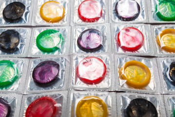 Colorful condoms background.