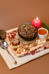 Kutia is a sweet wheat porridge of the Slavs. Traditional Christmas dish of the orthodox christians. Christmas kutia with honey, nuts, poppy, raisins and spices. Christmas eve food. Top view.