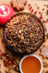 Kutia is a sweet wheat porridge of the Slavs. Traditional Christmas dish of the orthodox christians. Christmas kutia with honey, nuts, poppy, raisins and spices. Christmas eve food. Top view.