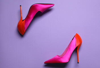 Pair of beautiful shoes on lilac background, top view. Space for text
