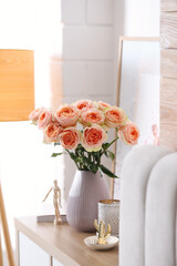Vase with beautiful flowers in modern room interior