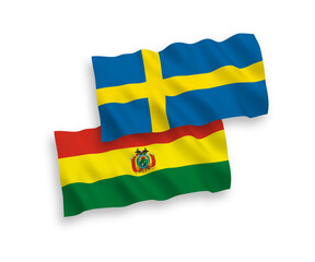 National vector fabric wave flags of Sweden and Bolivia isolated on white background. 1 to 2 proportion.