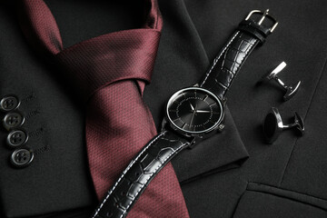 Luxury wrist watch, tie and cufflinks on black jacket, closeup - Powered by Adobe