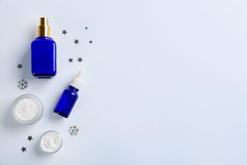Set of different cosmetic products on white background, flat lay. Winter care