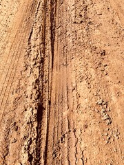 Muddy bumpy path in detail. Impassable road