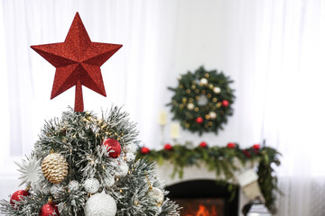 Beautiful Christmas tree with star topper in decorated room - Powered by Adobe