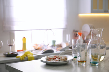Dirty dishes in kitchen after new year party