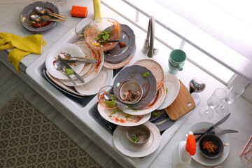 Dirty dishes in sink after new year party
