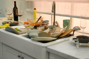 Dirty dishes in kitchen after new year party