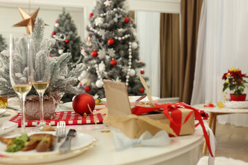 Mess on white table in room after new year party