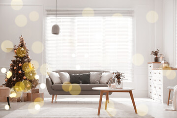 Beautiful Christmas tree and sofa in contemporary living room. Interior design