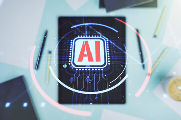 Double exposure of creative artificial Intelligence abbreviation and modern digital tablet on...