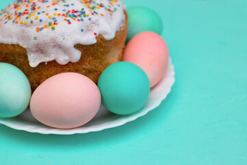 Easter decor: eggs in pastel colors and festive pastries, cake. Preparing for Easter. The photo