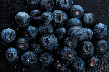 Fresh natural antioxidant blueberries pile, macro detailed close up