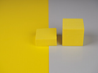 pedestal squares shadows on a yellow and gray background
