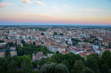 Fototapeta na wymiar Bergamo in Lombardy in Italy at sunset, panoramic view from the cable railway station in the Upper town (Città Alta) towards the lower town (Città Bassa)