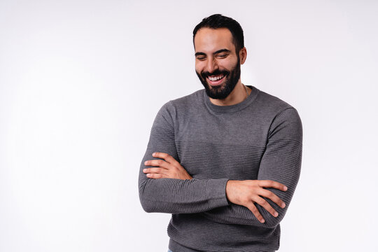 Smiling cheerful Arab man in casual clothing isolated over white background